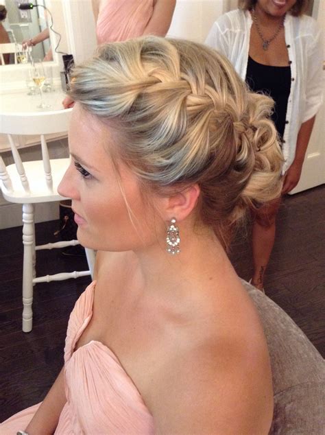 bridesmaid updos medium length hair|bridesmaid hairstyles with yellow flowers.